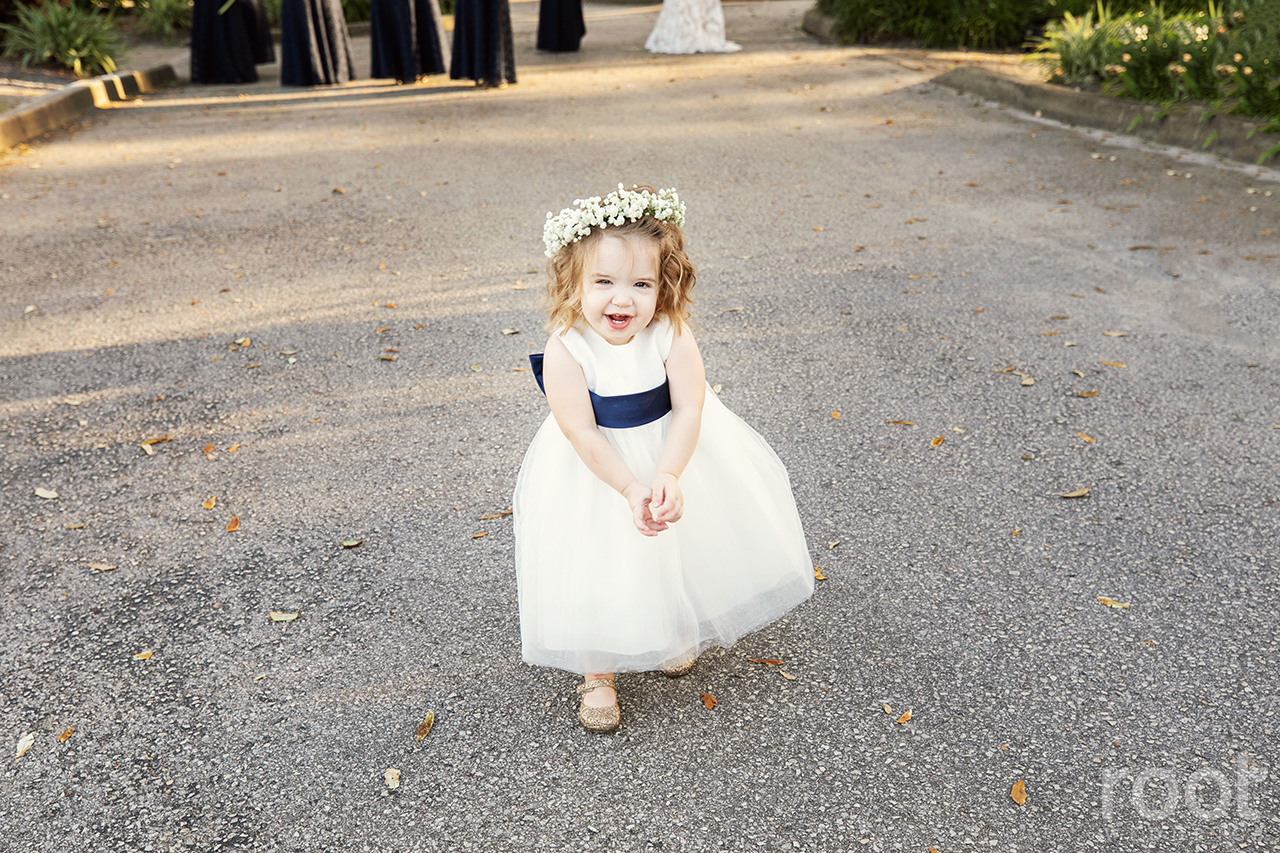 A flower girl with baby's breath floral crown