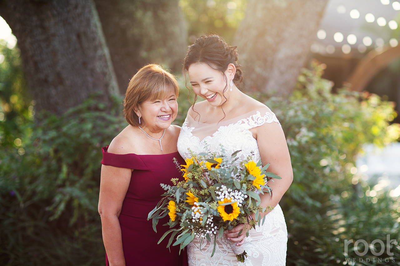 Bride and her mom laughing