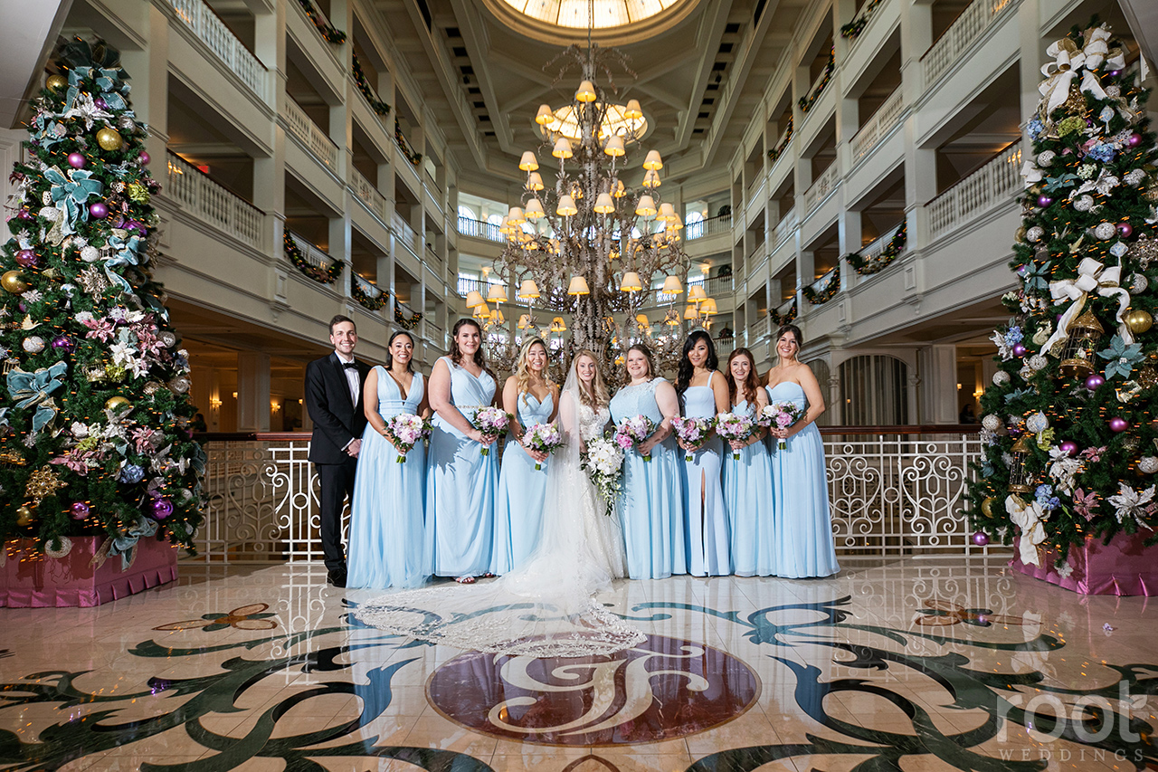 Long light blue bridesmaid dresses at the Grand Floridian chandelier