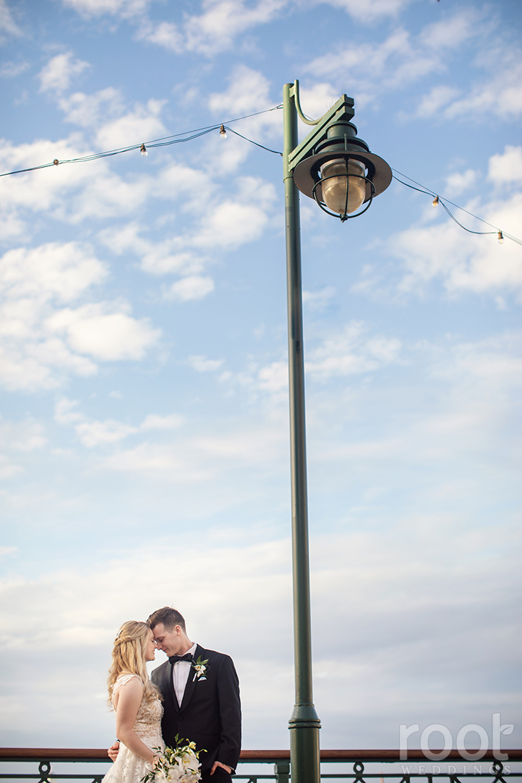 Sunset wedding photos at Disney's Boardwalk Inn Resort.