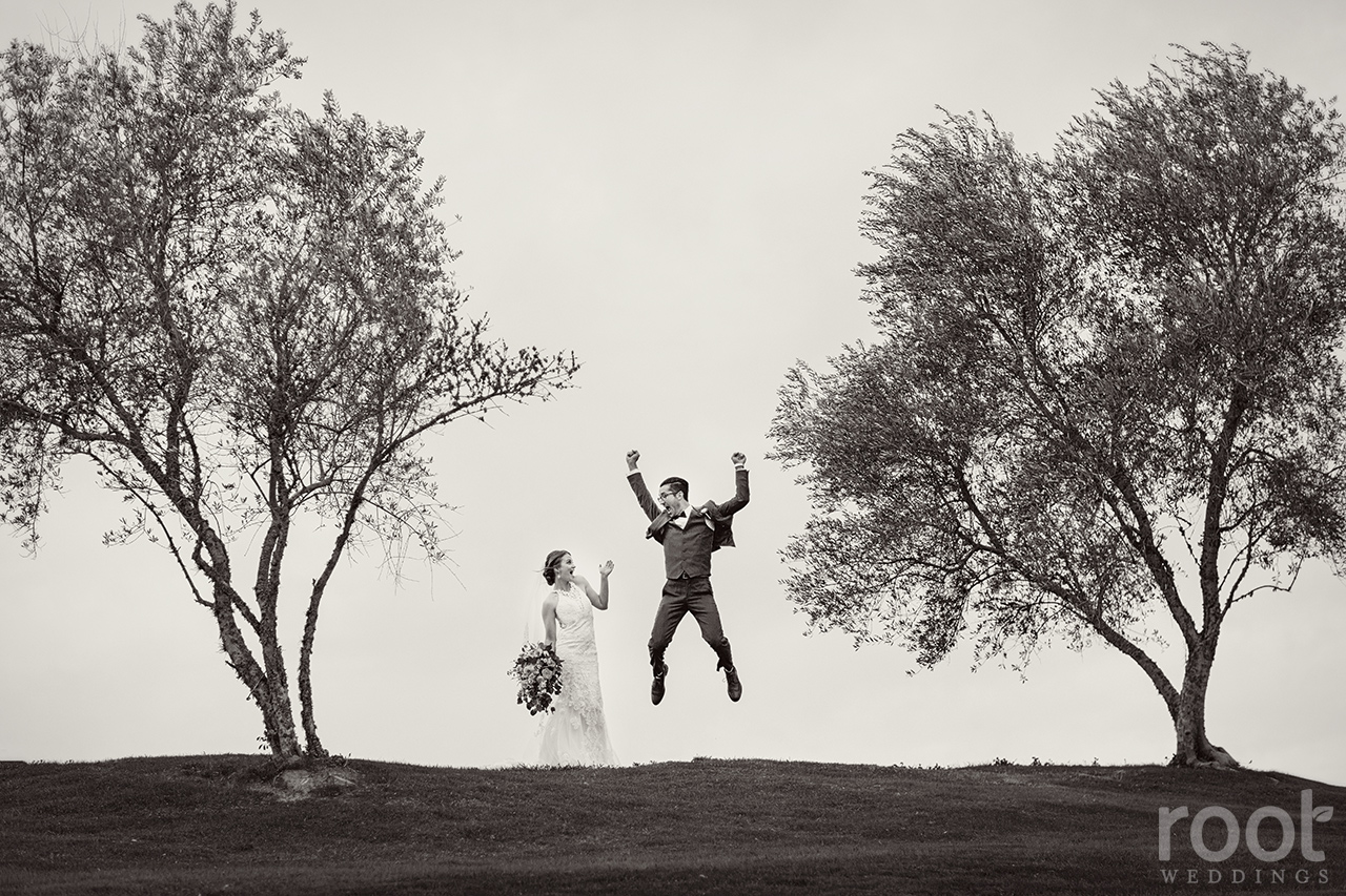 Groom jumping with joy at a Bella Collina Wedding