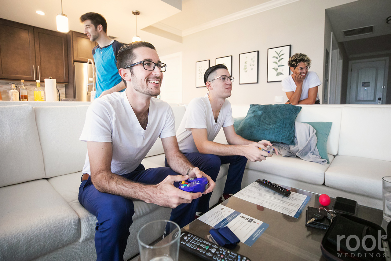 Groom playing video games before his wedding