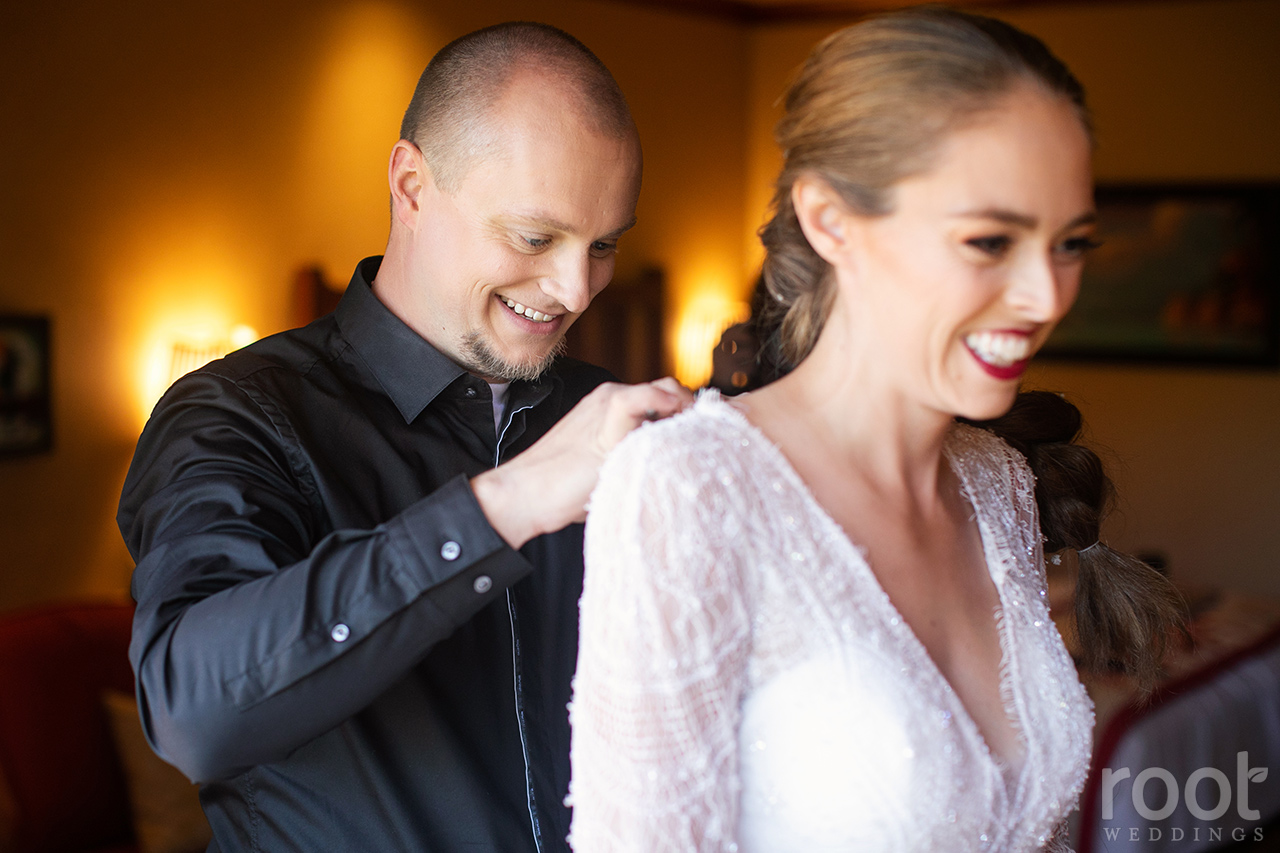 Bride and groom getting ready together