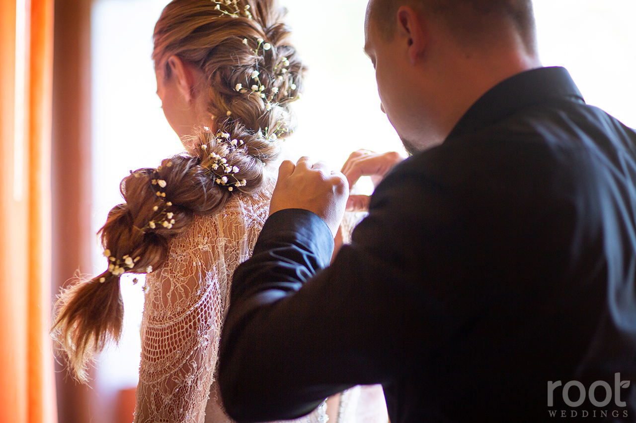 Bride and groom getting ready together