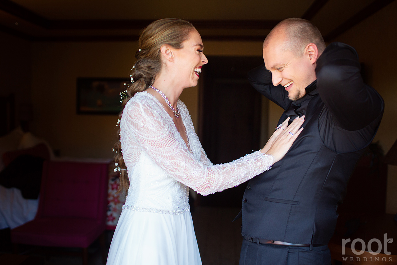 Bride and groom getting ready together